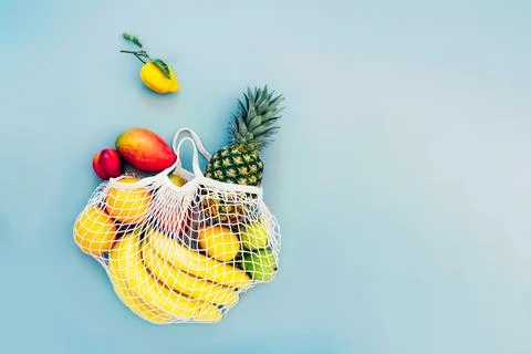 Top view string bag, mesh bag, grocery bag with organic fresh exotic fruits Stock Photos