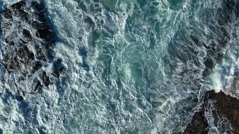 Top View Of Strong Waves Crashing At Rocky Sea Cliffs Stock Footage 258269433
