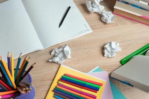 Top view student Desk for study, Table with stationery, pencils and felt pens Stock Photos