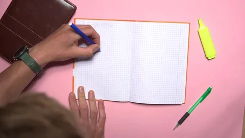 Top view of a student solving equations.  Video stock 248060858