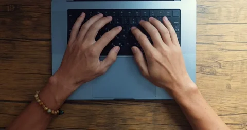 Top view, student work on a laptop and writing text using keyboard and touchpad Stock Footage 230260037