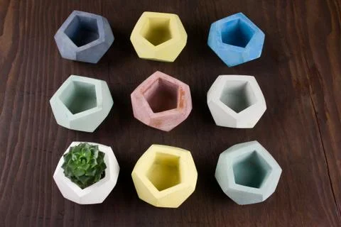 Top view succulent and empty concrete pots for plants on a wooden background, Stock Photos