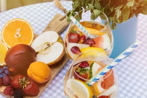 Top view of summer dinks, fruit cocktails on white wood table wi Stock Photos
