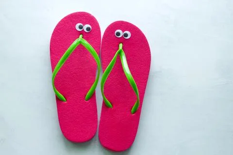 Top view summer flat lay flip flops with googly eyes Stock Photos