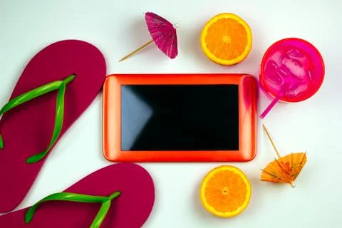 Top view summer set with tablet ,flip flops, cold cocktail and orange ice cre Stock Photos