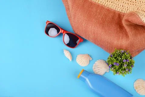 Top view of sunglasses, shells, starfish and sunblock Stock Photos
