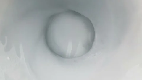 Top of view of super slow motion shot of fresh cream white milk vortex Video stock 252135095