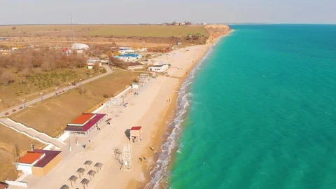 Top view of a superb lonely and deserted beach on the shores of the azure sea. Stock Footage 106946100