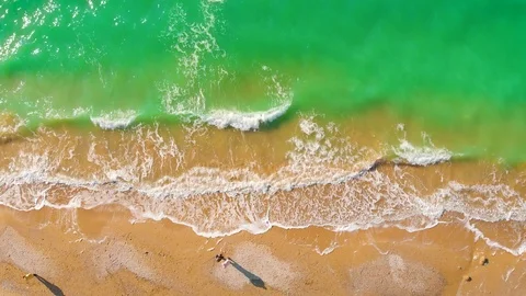 Top view of a superb lonely and deserted beach on the shores of the azure sea. Stock Footage 106946610