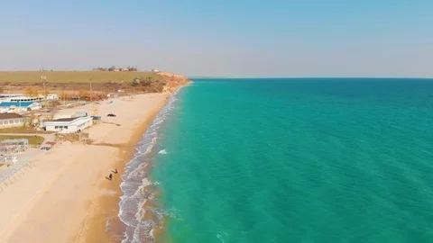 Top view of a superb lonely and deserted beach on the shores of the azure sea. Stock Footage 106946842