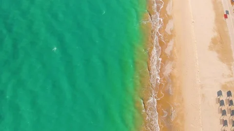 Top view of a superb lonely and deserted beach on the shores of the azure sea. Stock Footage 106947164