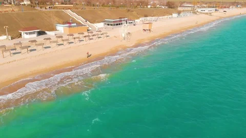 Top view of a superb lonely and deserted beach on the shores of the azure sea. Stock Footage 106947929