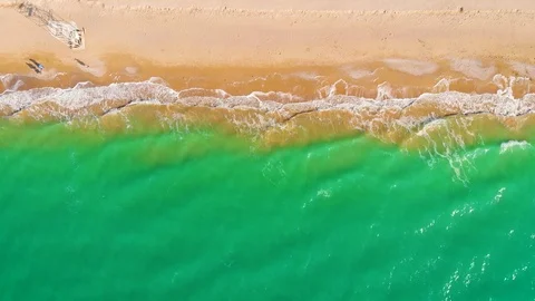 Top view of a superb lonely and deserted beach on the shores of the azure sea. Stock Footage 106948354