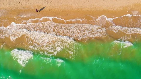 Top view of a superb lonely and deserted beach on the shores of the azure sea. Stock Footage 106951028