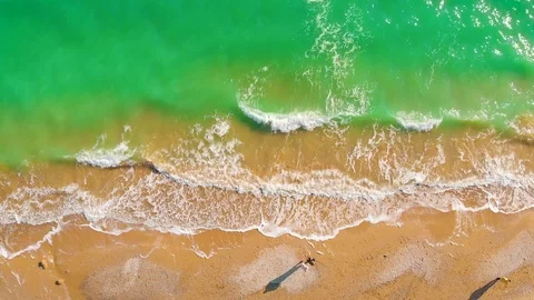 Top view of a superb lonely and deserted beach on the shores of the azure sea. Stock Footage 106952372
