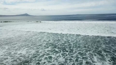 Top view of surf breaking on abeach with dunes Video stock 147696320