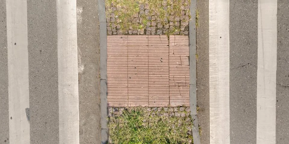 Top view of surface of pedestrian path with paving slabs with the border of l Stock Photos