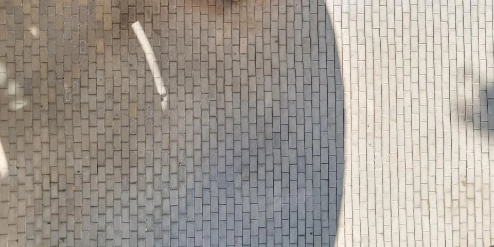 Top view of surface of pedestrian path with paving slabs with the border of l Stock Photos