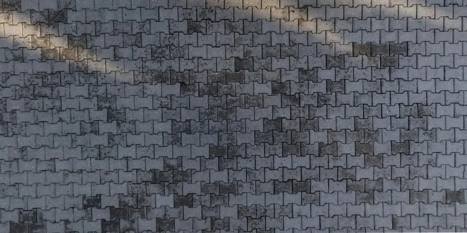 Top view of surface of pedestrian path with paving slabs with the border of l Stock Photos