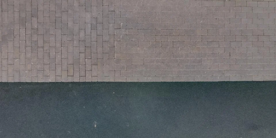 Top view of surface of pedestrian path with paving slabs with the border of l 스톡 사진