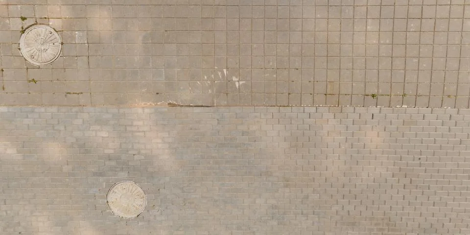 Top view of surface of pedestrian path with paving slabs with the border of l Stock Photos