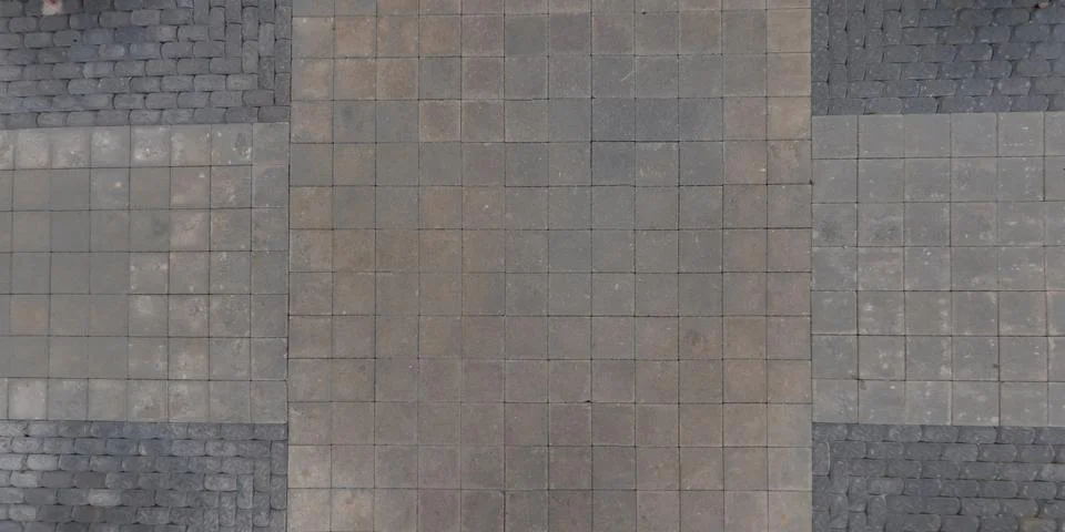 Top view of surface of pedestrian path with paving slabs with the border of l Stock Photos