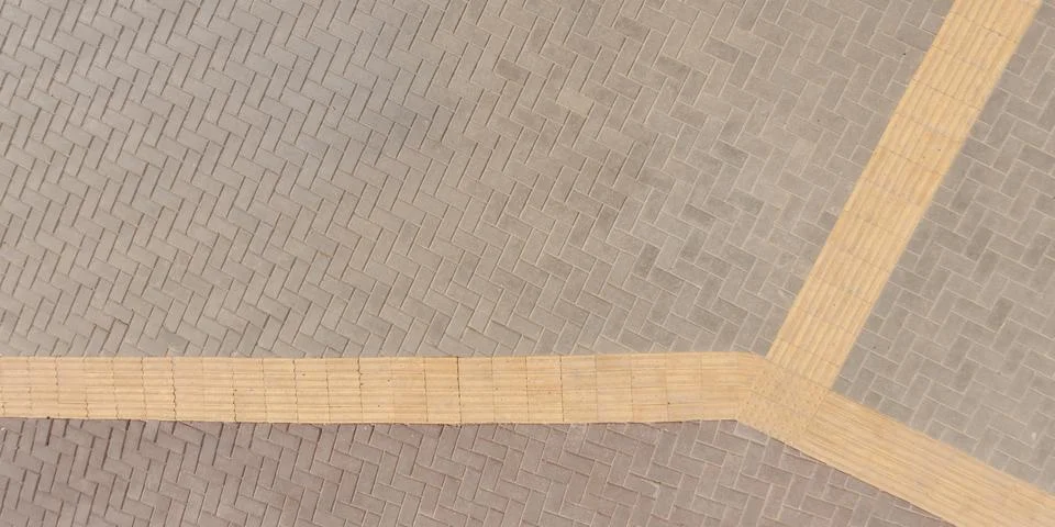 Top view of surface of pedestrian path with paving slabs with the border of l Stock Photos
