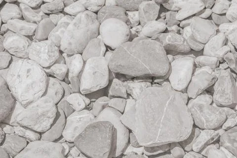 Top view surface photo of smooth rounded light grey river pebbles for natur.. Stock Photos