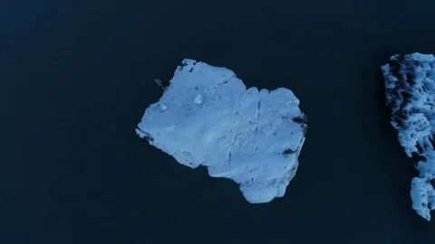 Top view of surfer jumping into cold water and swimming, Jokulsarlon, Iceland Stock Footage 120479202