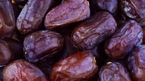 Top view of sweet dried dates texture circle rotation close up Stock Footage 239027664