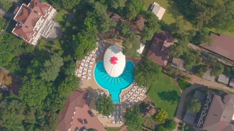 Top view of swimming pool in the park view resort Stock Footage 127376513