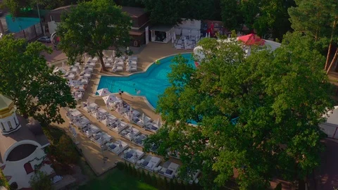 Top view of swimming pool in the park view resort Stock Footage 127377032