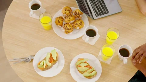 Top view of a table with breakfast and a laptop Stock Footage 240548376