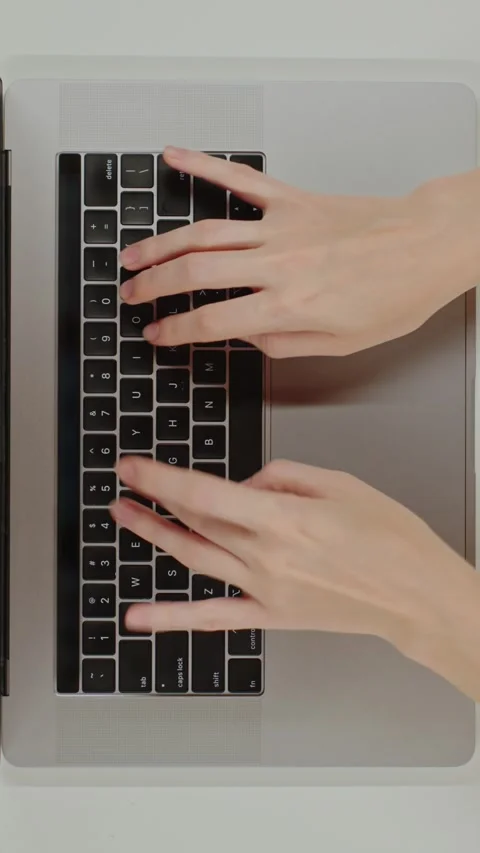 Top view table Close-up Female hands typing prompt on a keyboard laptop using AI Stock Footage 281573727