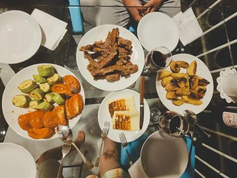 Top view of the table with dinner. BBQ meat, grilled vegetables, grilled chee Stock Photos