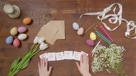 Top view of a table with items to create a composition for Easter. Easter Stock Footage 171484431