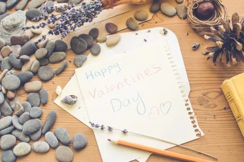 Top view on the table. Note to the Valentine's Day. Vintage wallpaper. Stock Photos