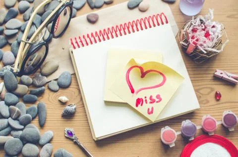 Top view on the table. Note to the Valentine's Day. Stock Photos