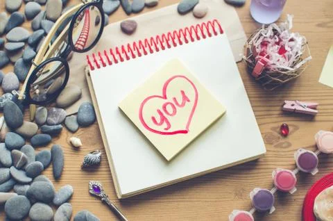 Top view on the table. Note to the Valentine's Day. Stock Photos