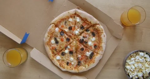 Top view on table with pizza and popcorn Stock Footage 135231696