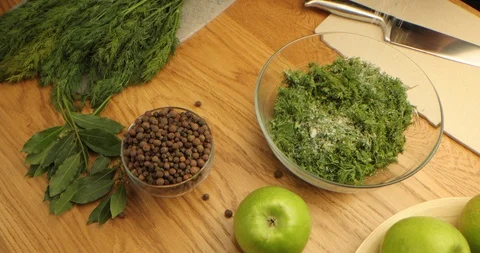 Top view. on the table spices, apples, cutting board, knife, dill in a glass Stock Footage 126152027
