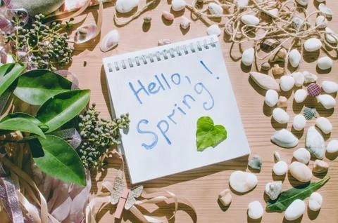 Top view on the table. Spring message. Hello spring. Stock Photos