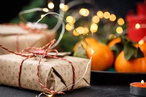 Top view of a table with tangerines, candles, and gift boxes Stock Photos