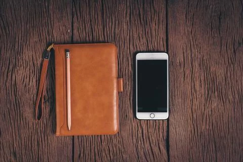 Top view Tablet computer and phone on wood background Stock Photos