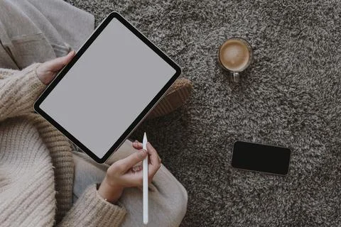 Top view tablet mockup with copy space. Woman using digital tablet with blank Stock Photos