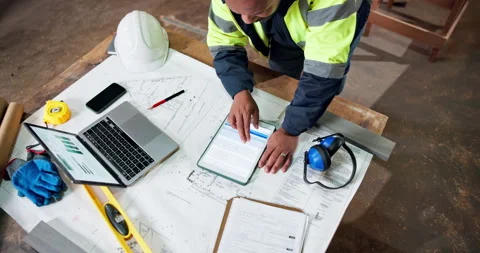 Top view, tablet screen and engineer at construction site for building Video stock 337985722