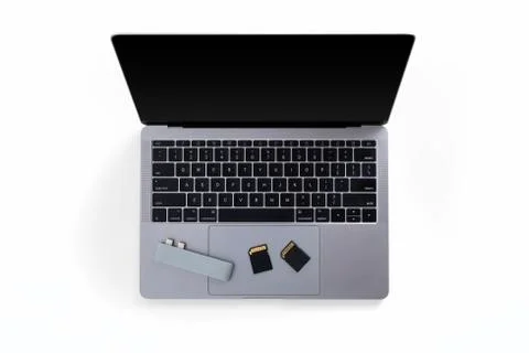 Top view of tabletop with laptop, memory cards and card reader Stock Photos
