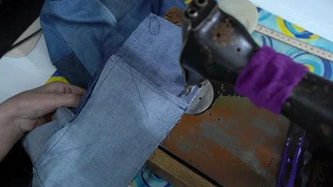 Top view, tailor sews on an old home sewing machine Stock Footage 223384388