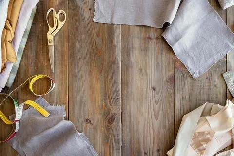 Top view tailor workplace background with fabric Stock Photos