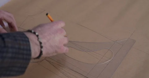 Top view of tailor's hand drawing a curv... | Stock Video | Pond5